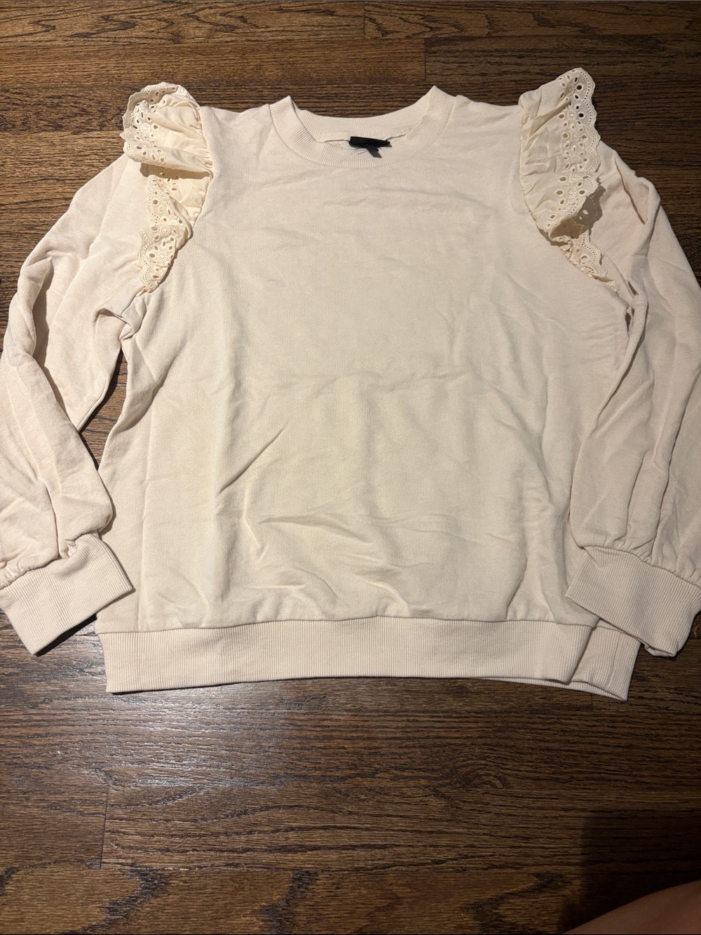 Who wore what puff sleeve eyelet ruffle sweatshirt